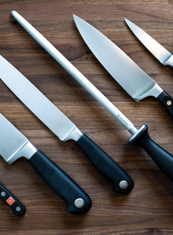 row of knives on cutting board